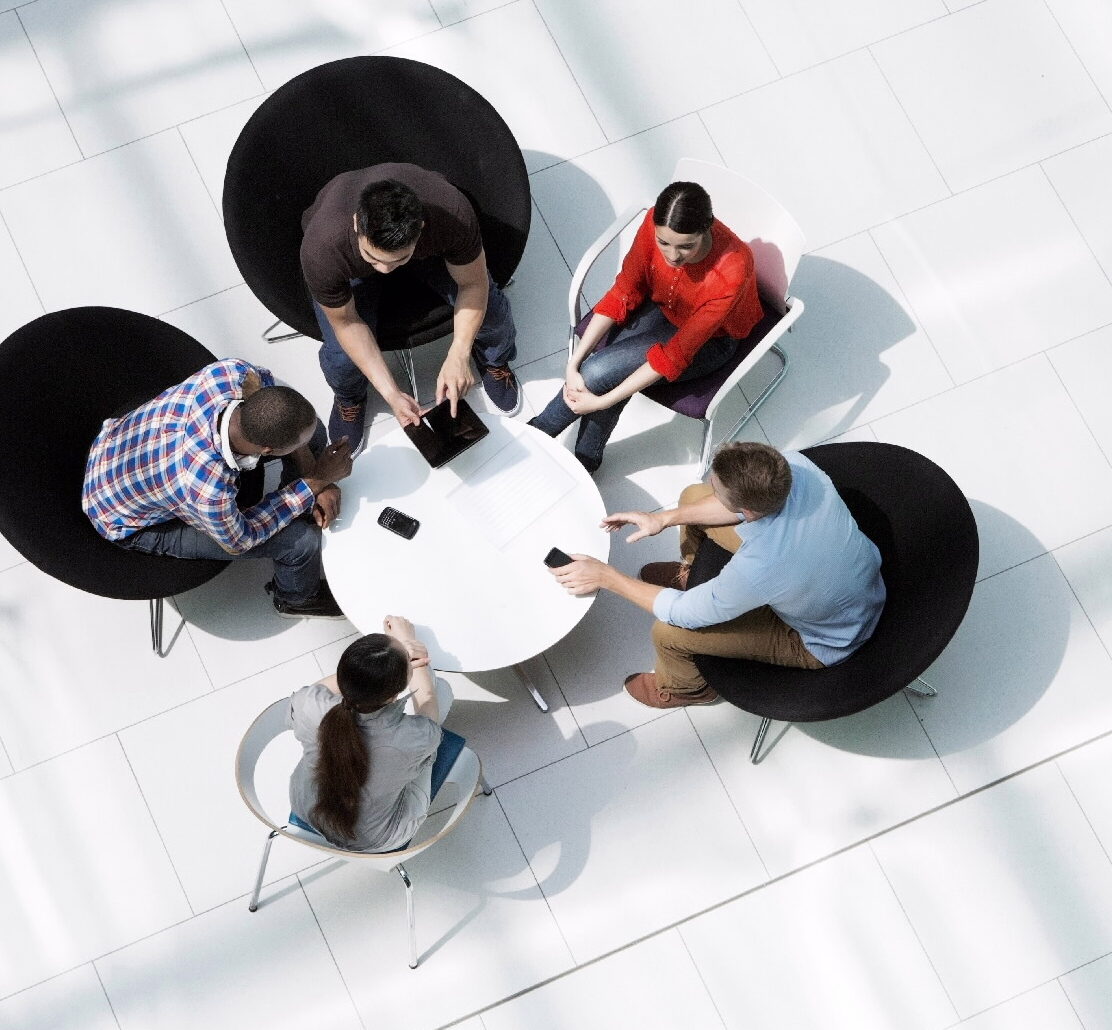 aerial view of people at a table collaborating
