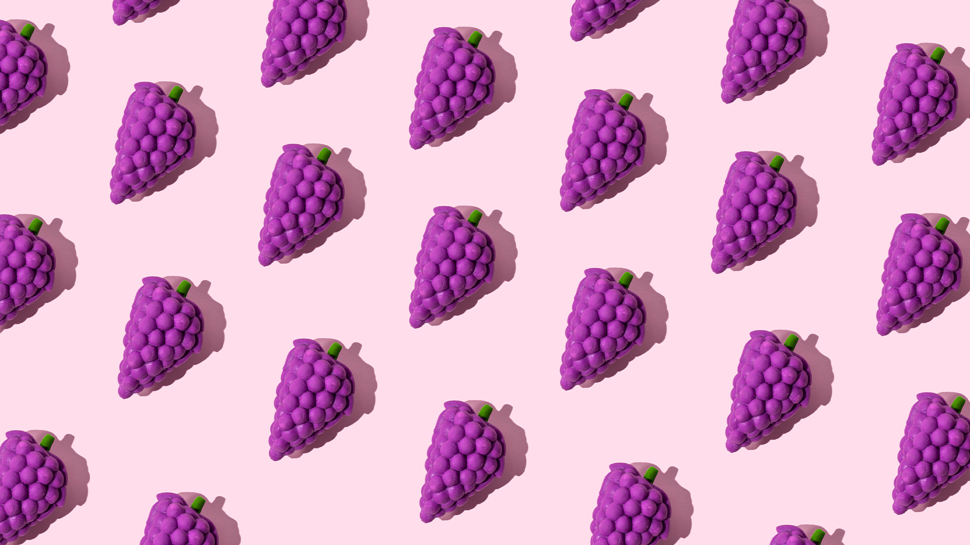 Bunches of purple grapes in repeating pattern