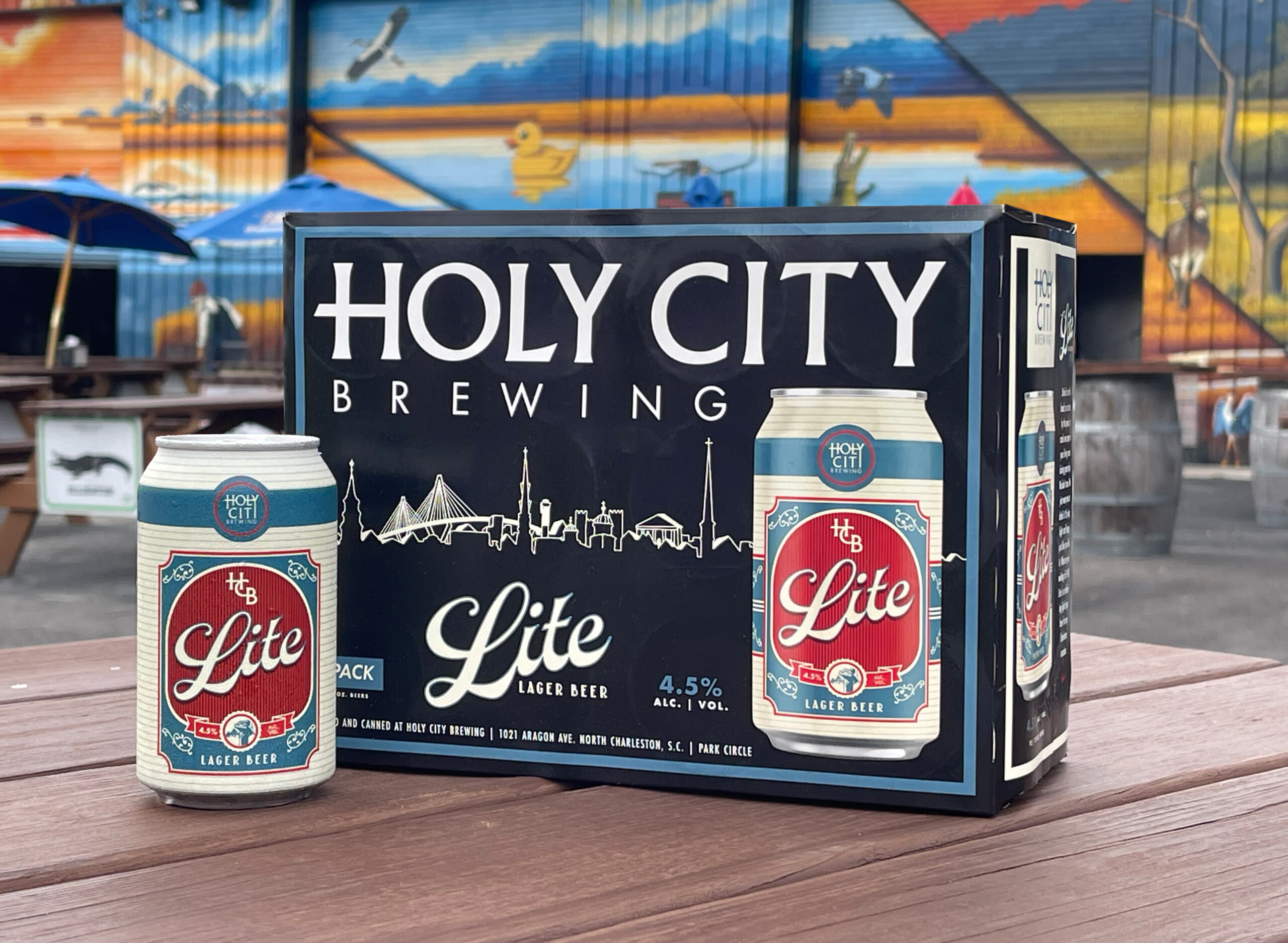 Holy City Brewing Lite Lager six-pack packaging on a patio table