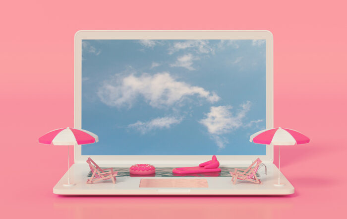 Beach equipment on a computer with clouds on the screen