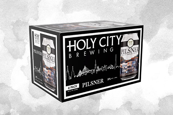 Holy City Brewing Pilsner six-pack packaging on grey background