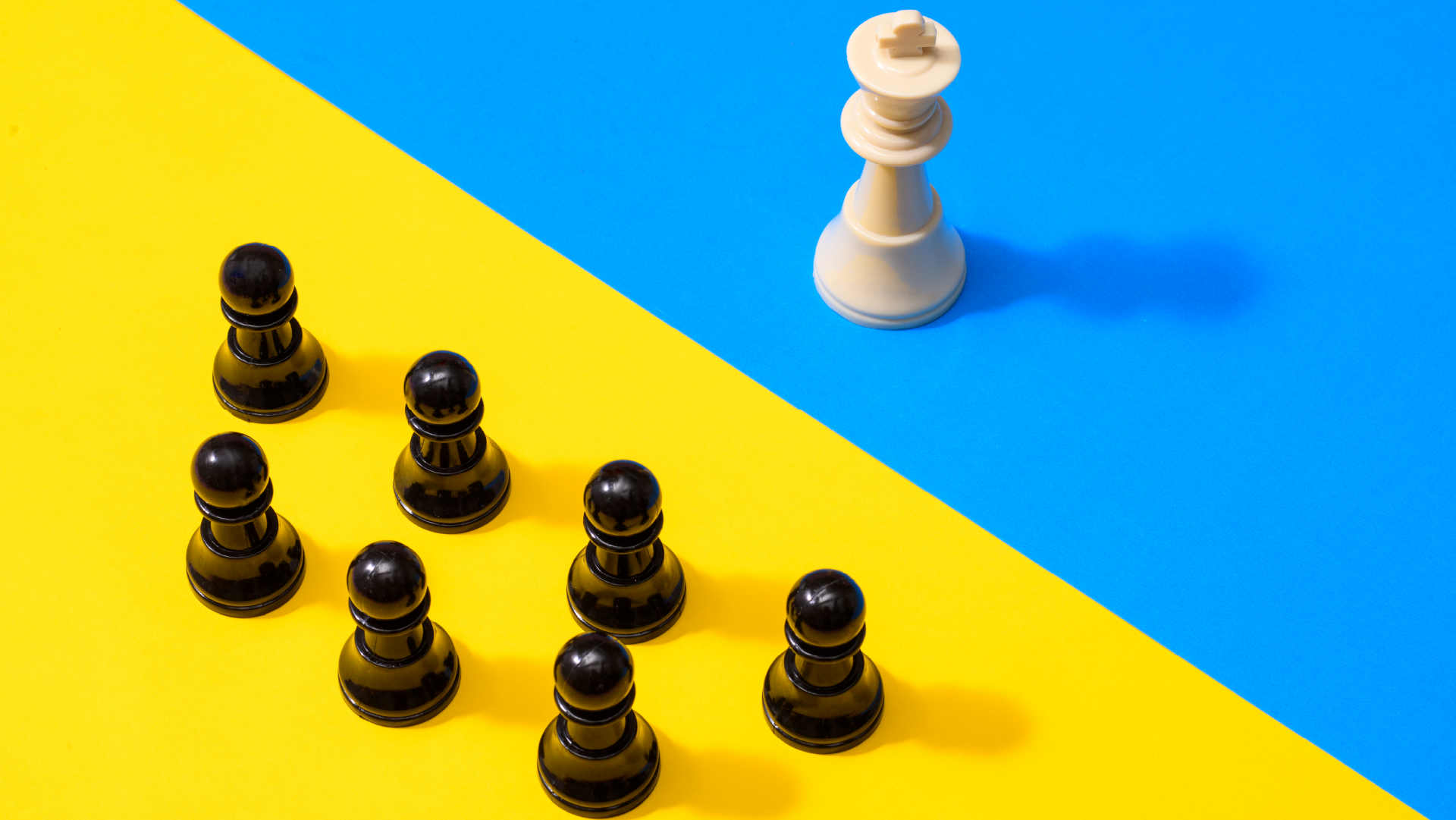 Chess pieces on yellow and blue background