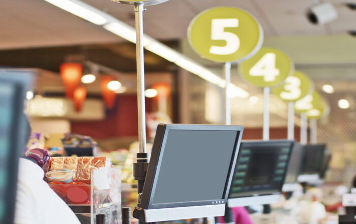 Cashier's display screen at store checkout counter. Row of screens are seen in this shallow DOF picture.