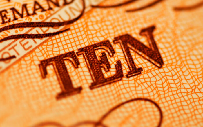 Ten written in dark orange print on patterned background