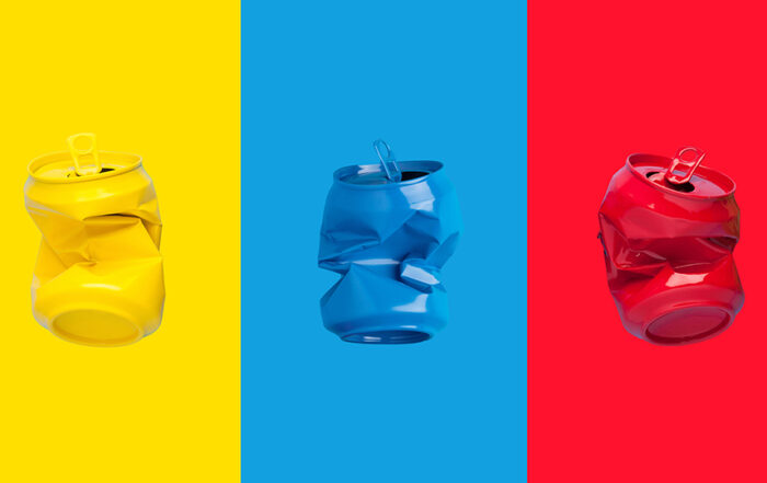 Used and crumpled cans in red, blue and yellow.