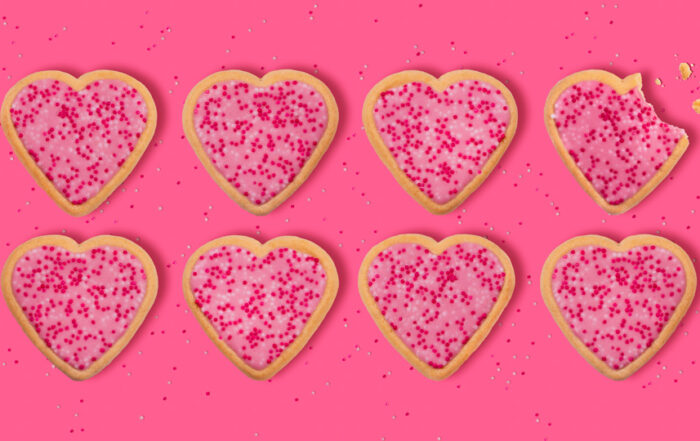 Eight pink frosted valentine heart sugar cookies