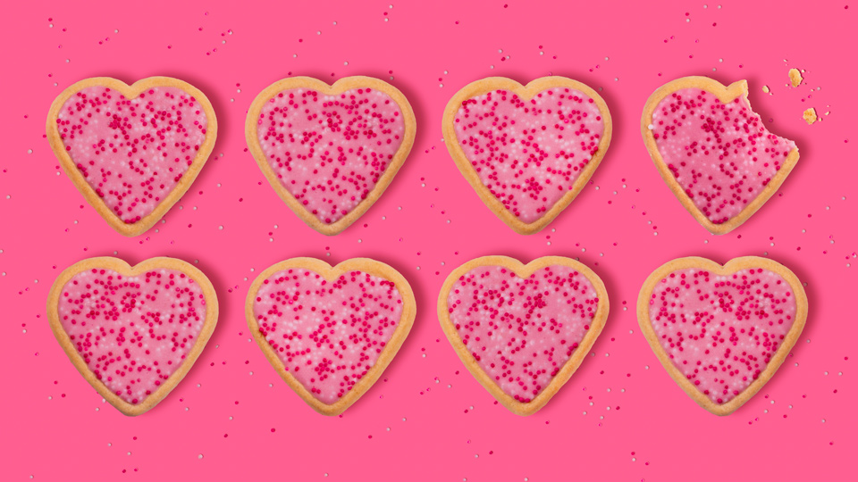 Eight pink frosted valentine heart sugar cookies