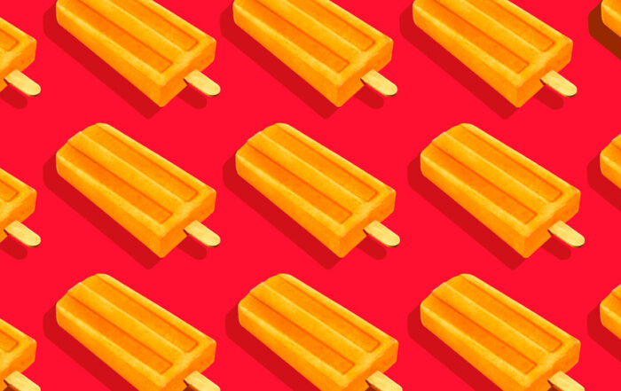 Orange popsicles in a repeating pattern