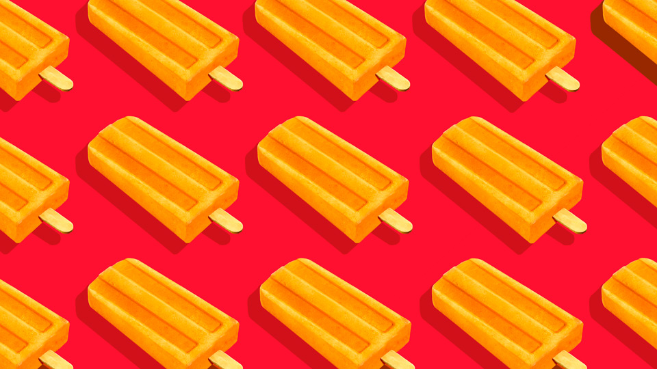 Orange popsicles in a repeating pattern