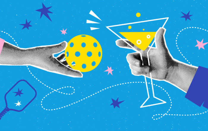 Hands holding a martini and a pickleball