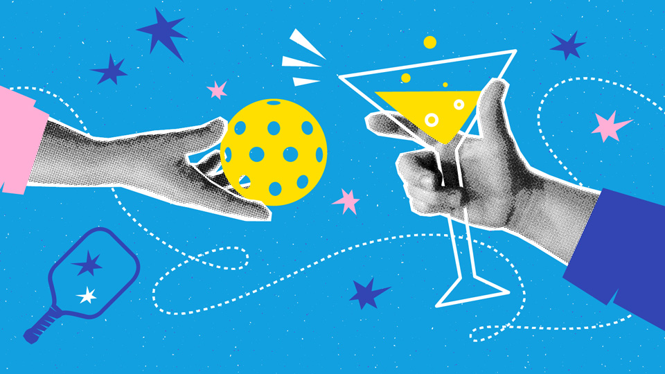 Hands holding a martini and a pickleball